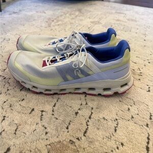 On Running White and Blue Athletic Shoes